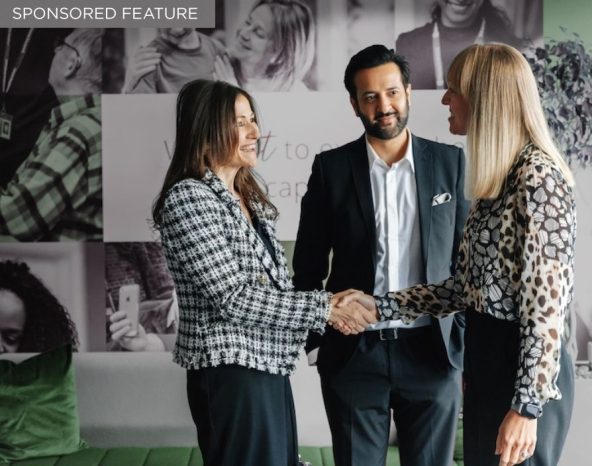 Home Instead franchise network representatives connecting with prospective franchise owners at a franchise exhibition.